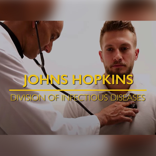 Doctor using stethoscope on patient. Text in yellow, "Johns Hopkins Division of Infectious Diseases"