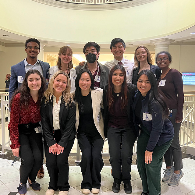 A group of students pose together at the MD state house in Annapolis.