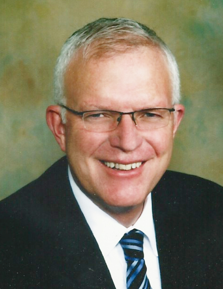 A photo of Randy Davis wearing a black suit.