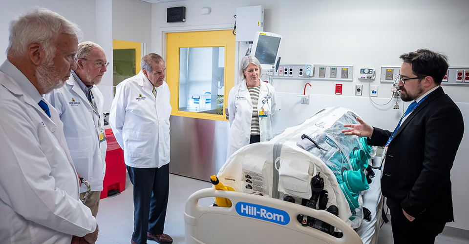 Lisa Maragakis and Christopher Sulmonte discuss the specialized equipment in the biocontainment unit.