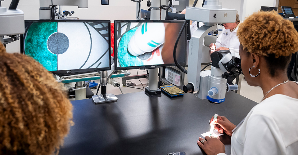 Attendees try out equipment in the OphSET lab.