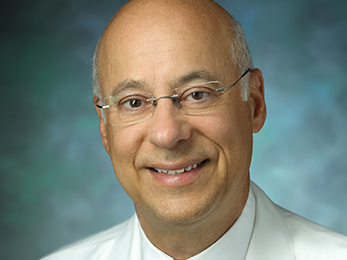 Headshot of Doctor Smiling.