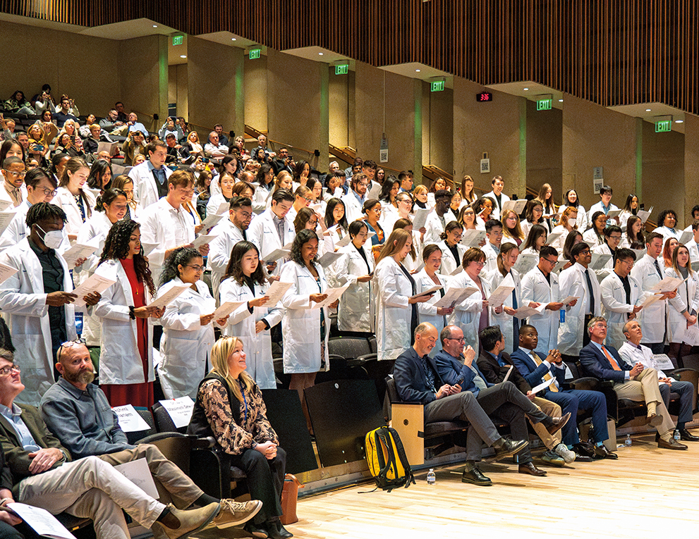 Graduate students recite the Oath of the Scientist during the 2023 Graduate Coating Ceremony.