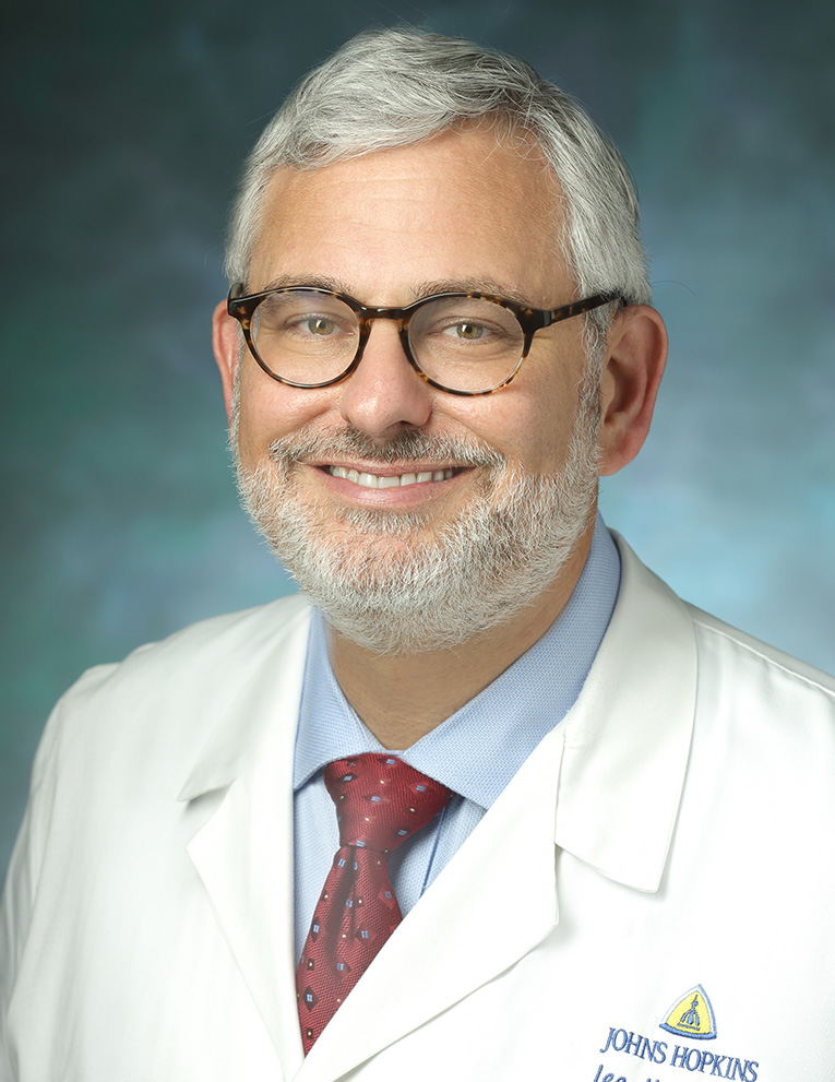 Formal portrait of otolaryngologist Lee Akst