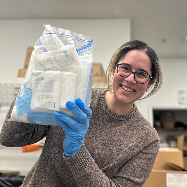 Maria Sckaff holding a harm reduction kit