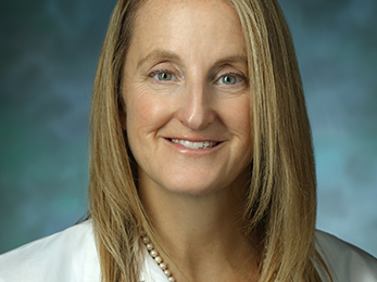 Portrait of Dawn LaPorte in white lab coat