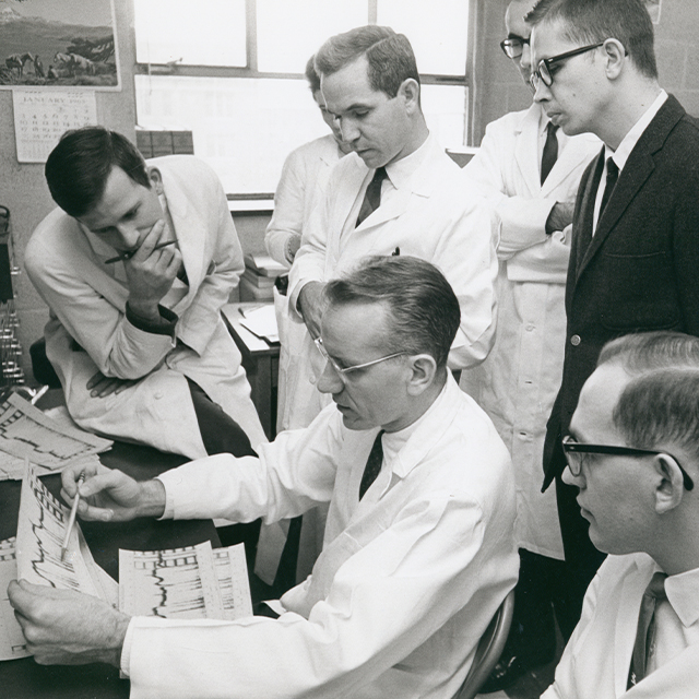 A younger Victor McKusick, seated at center, with Johns Hopkins trainees, ca. 1965.