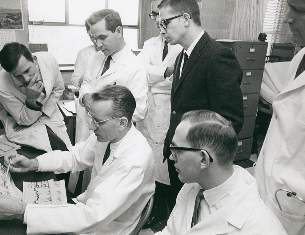 A younger Victor McKusick , seated at center, with Johns Hopkins trainees, ca. 1965.