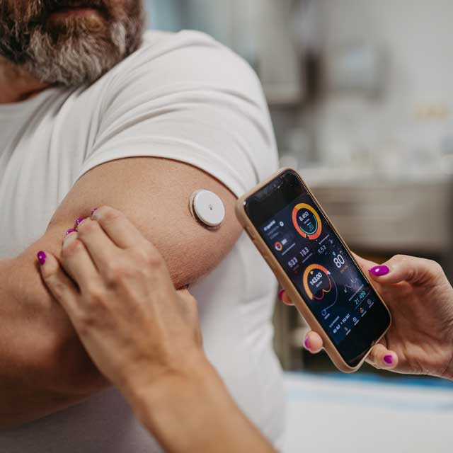 Man with diabetes getting blood sugar reading