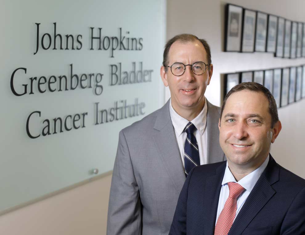 Medical oncologist Noah Hahn, M.D., and urologist Max Kates, M.D.