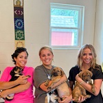 Eva Ramgopal and others holding dogs.