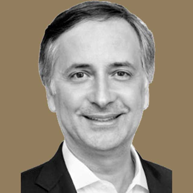 A black and white headshot of Victor Velculescu on a gold background.