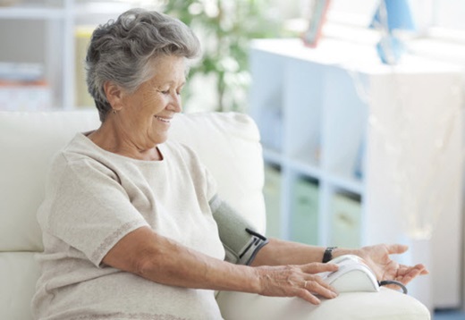 older woman taking her blood pressure