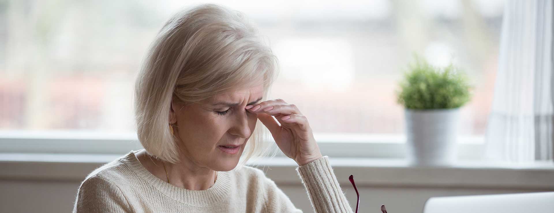 Woman rubbing her eyes