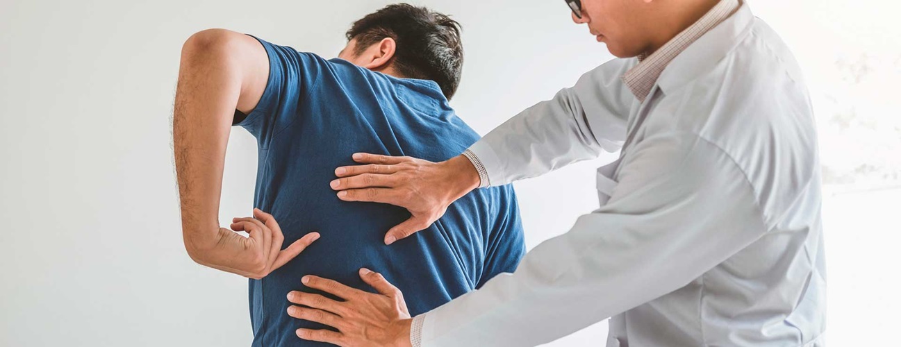 Spine doctor consulting with patient about back problems