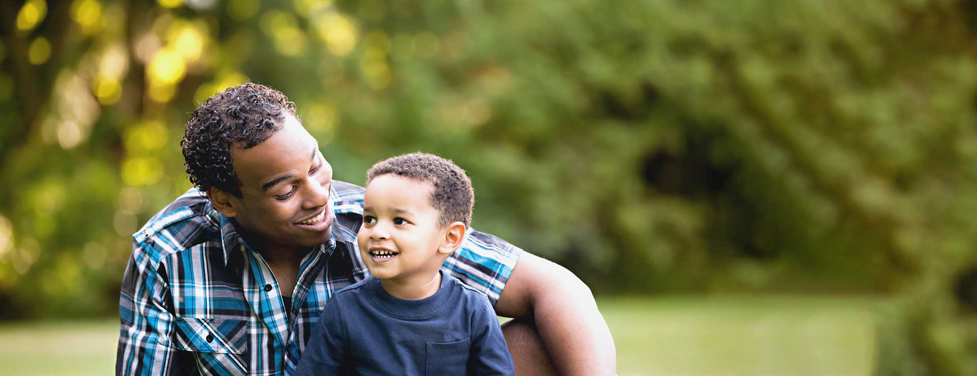A man and his son spend time together outdoors.