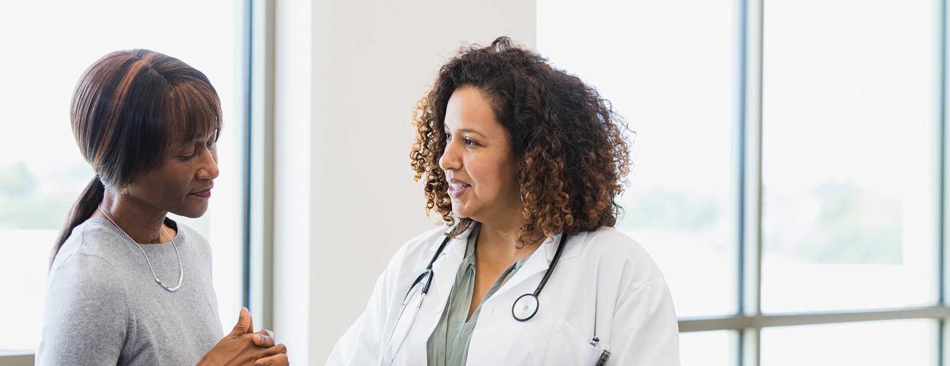 Doctor talking with female patient.