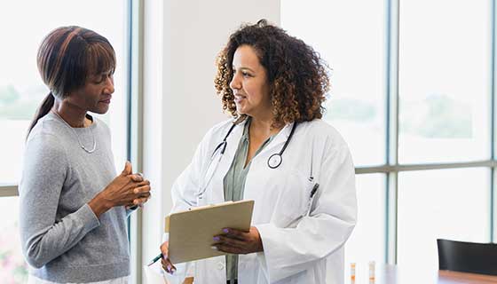 Doctor talking with female patient.