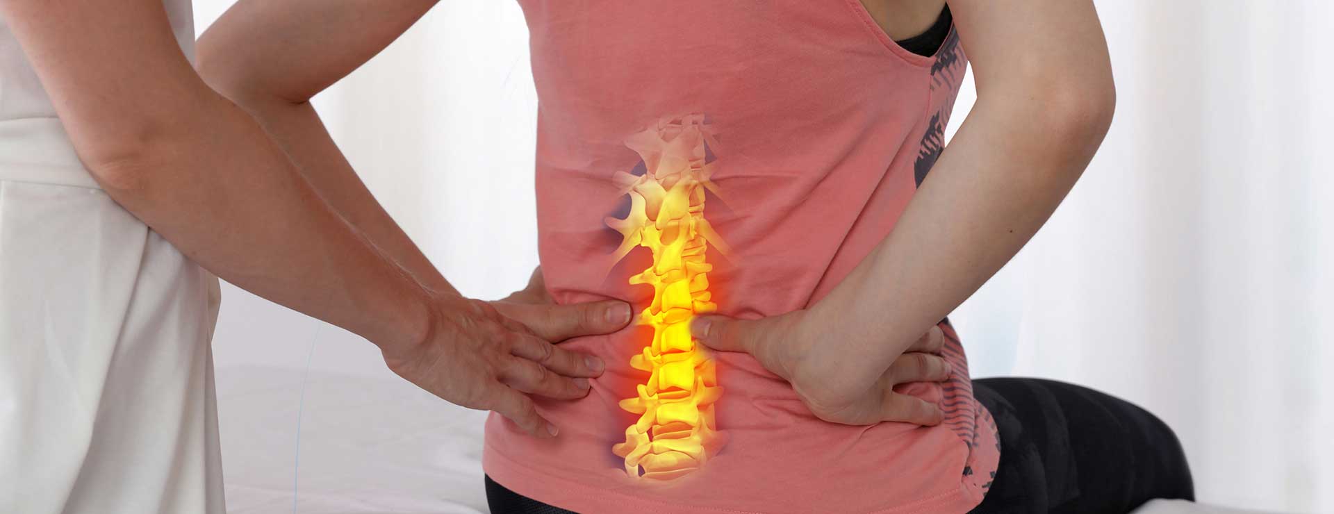 Doctor examining woman's back