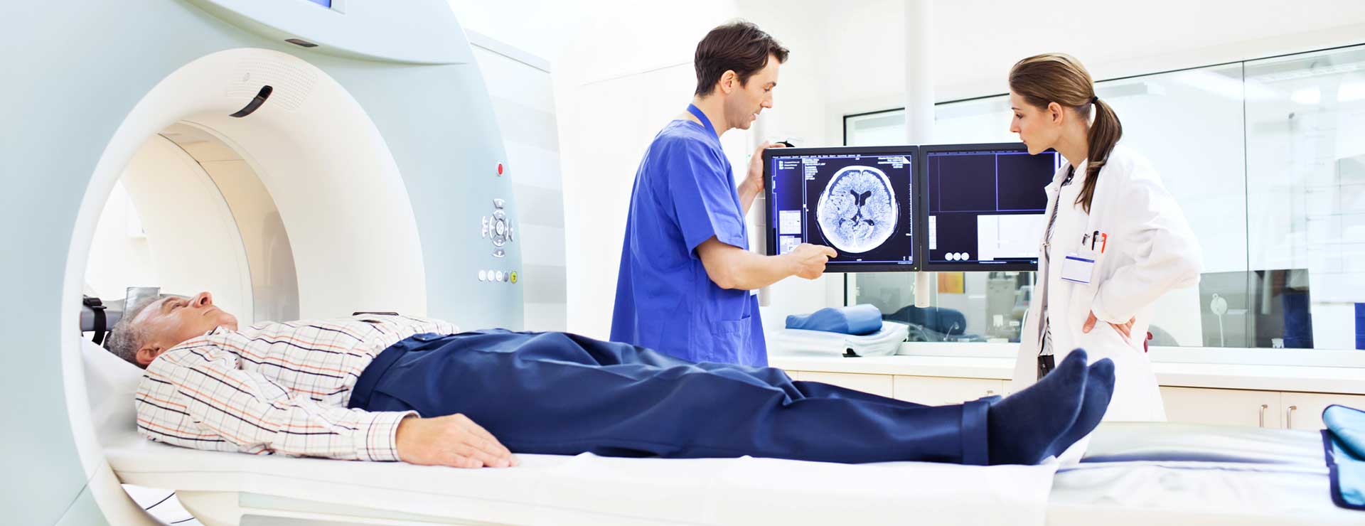 Doctor discussing CT scan of brain