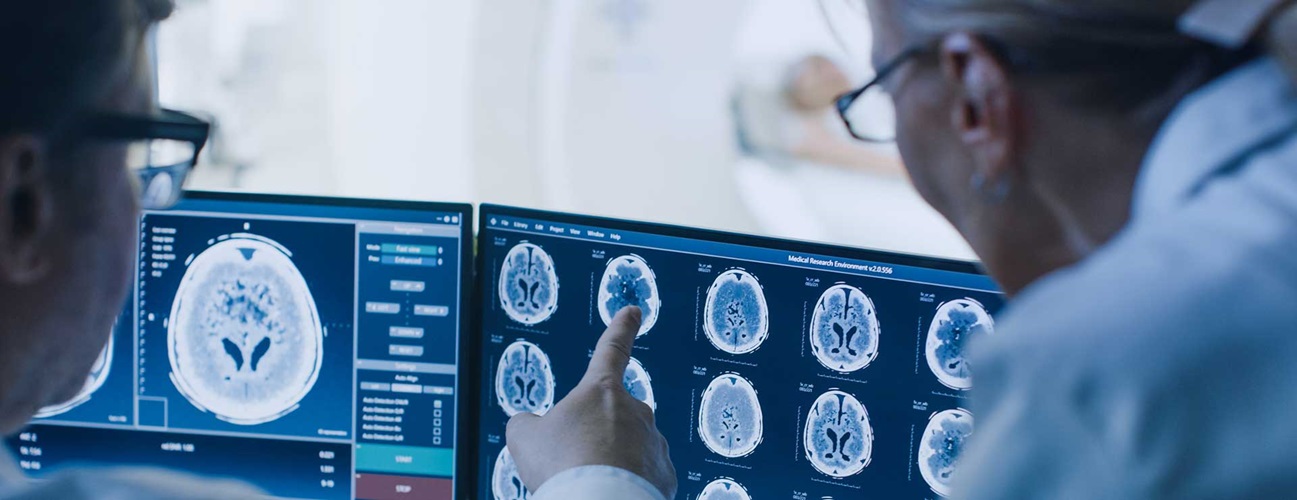 Doctors examining brain scans