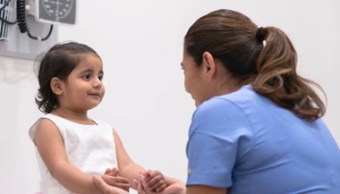 Child with a doctor in a clinical setting