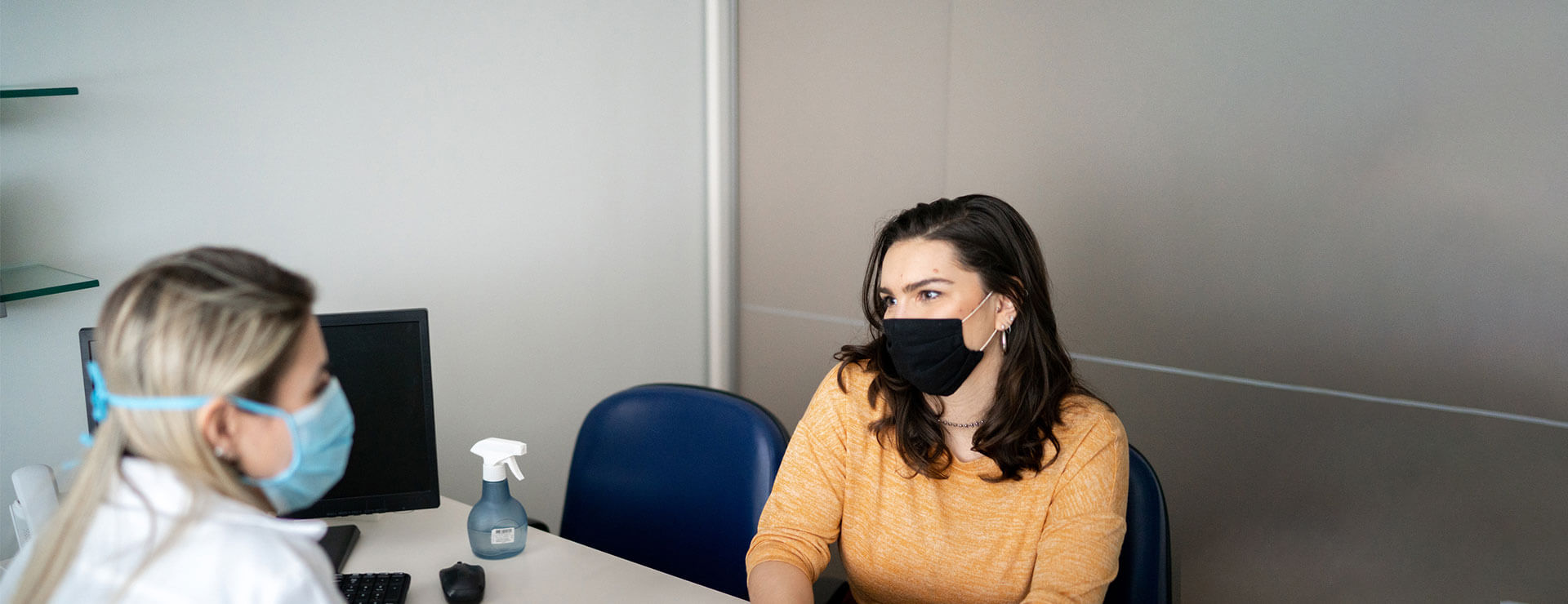 female patient speaks to doctor