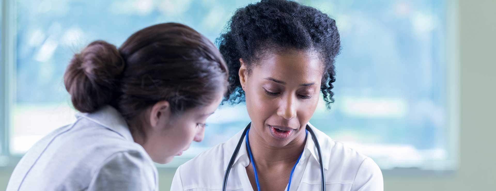 woman talking to doctor