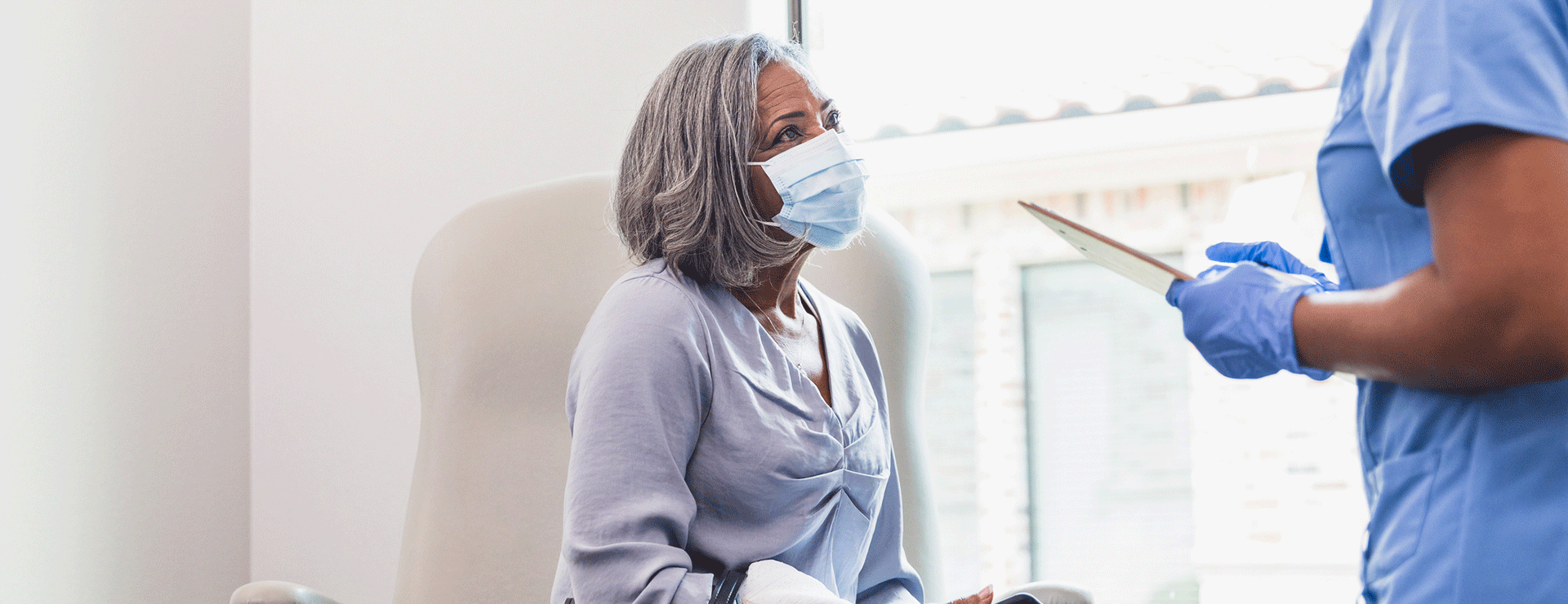 patient with doctor filling out form