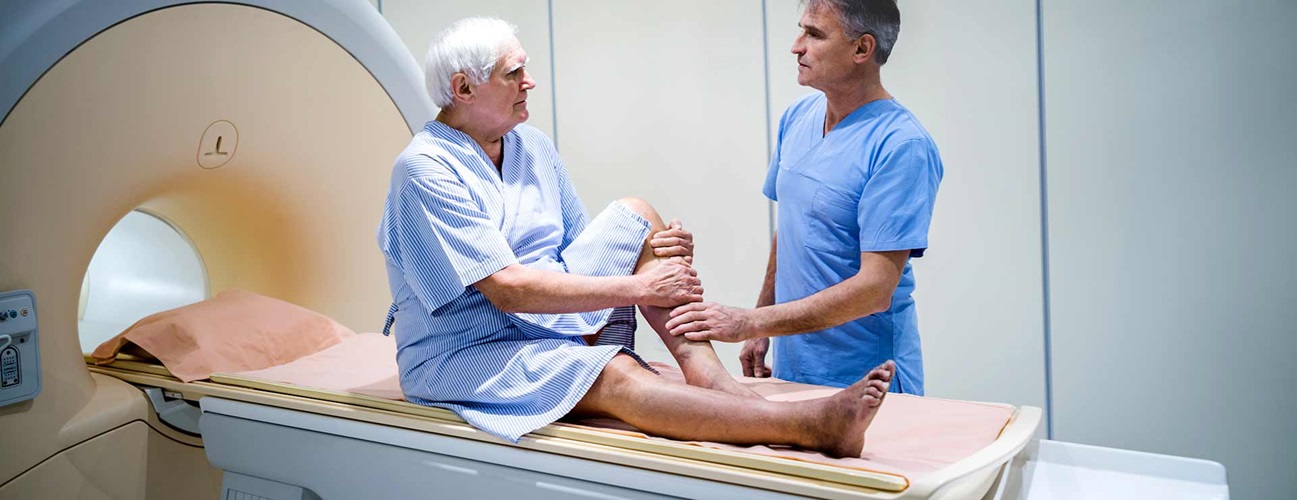 a man prepares to undergo a medical scan