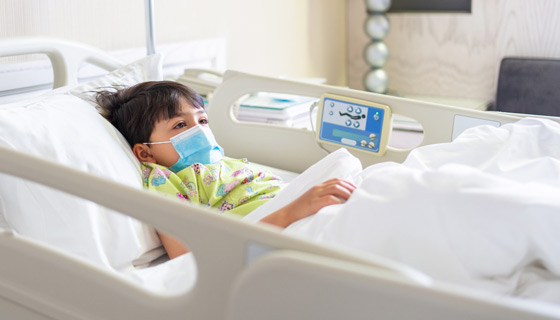 Child lying in a hospital bed