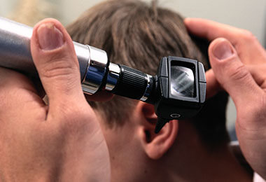 doctor examining child for cholesteatoma 