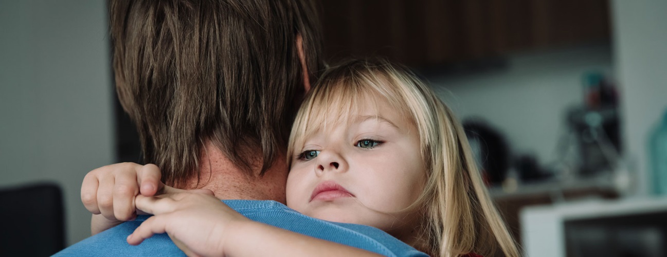 chest pain in children - A father hugging his young daughter