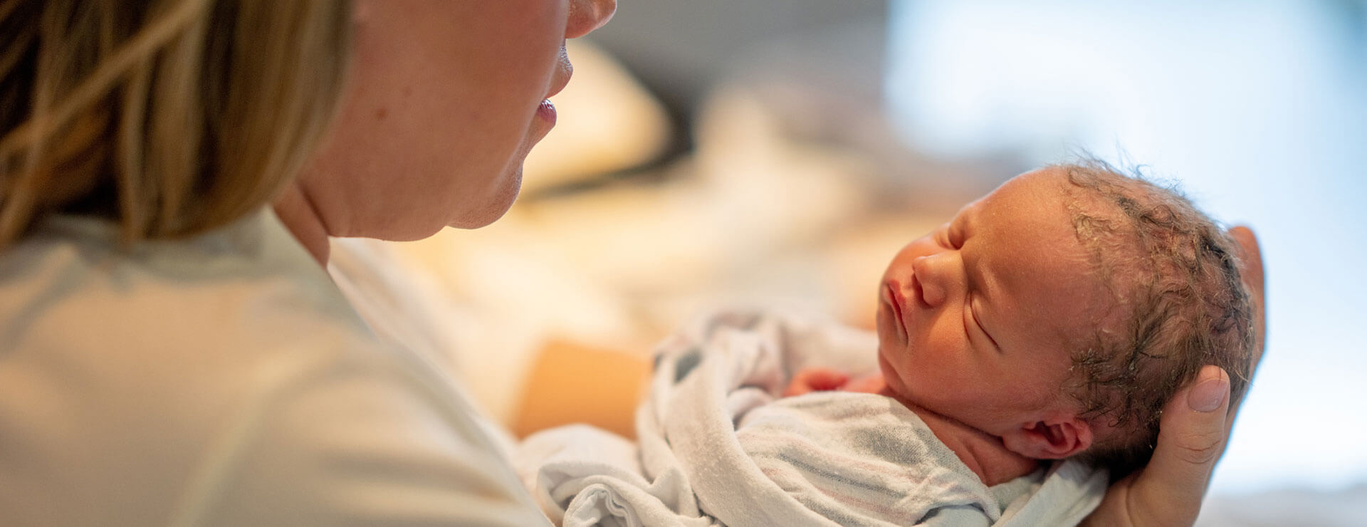 An infant being held