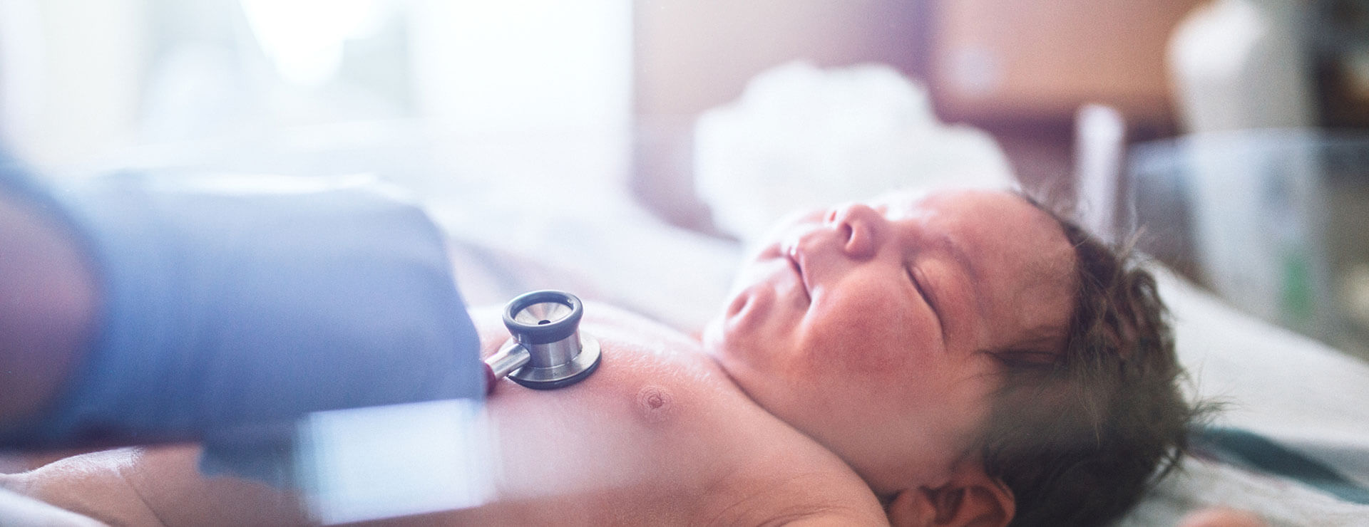 A newborn baby gets its heart checked