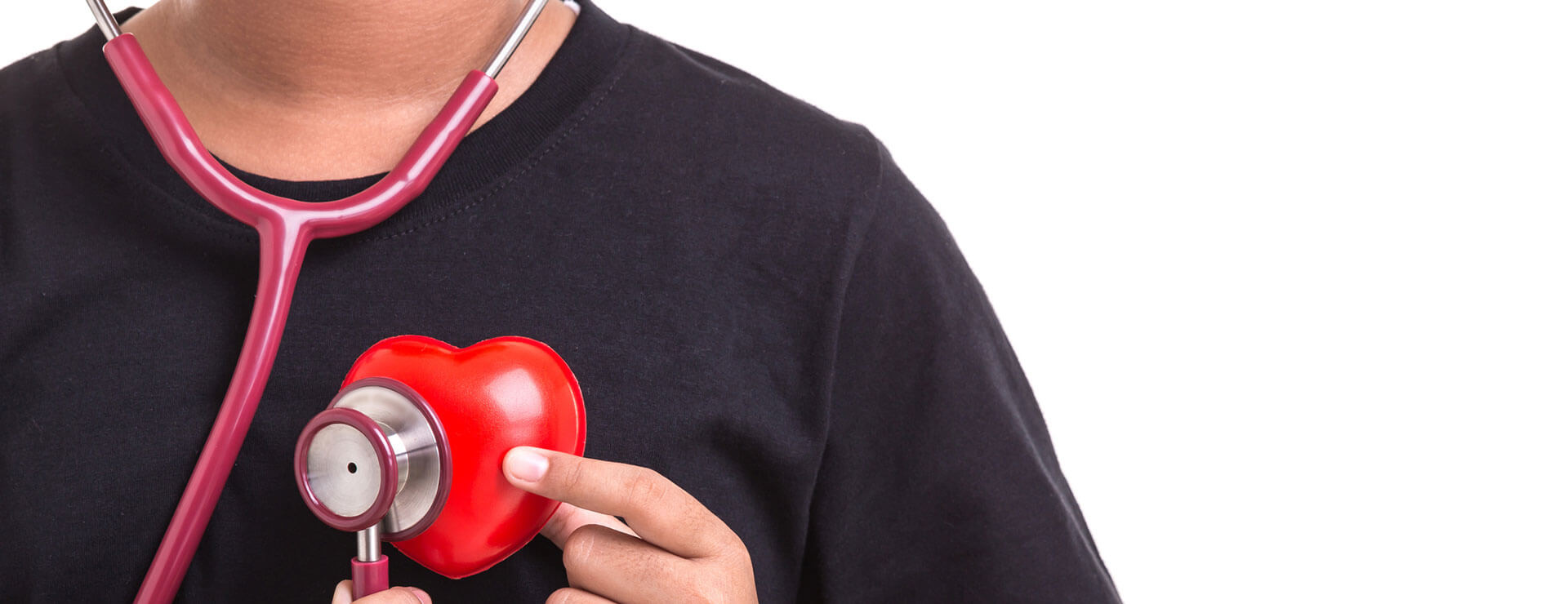 a child holds a plastic heart and stethoscope after surgery for pulmonary atresia with VSD for children