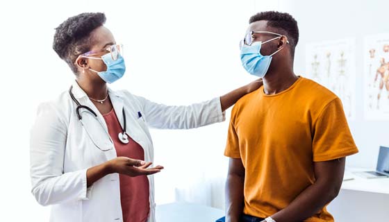 Doctor speaks with patient
