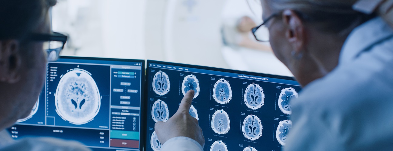 Doctors examine brain scans.