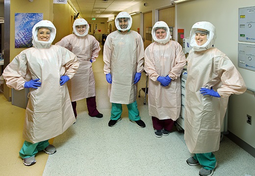 A team of recovery specialists wear PPE.