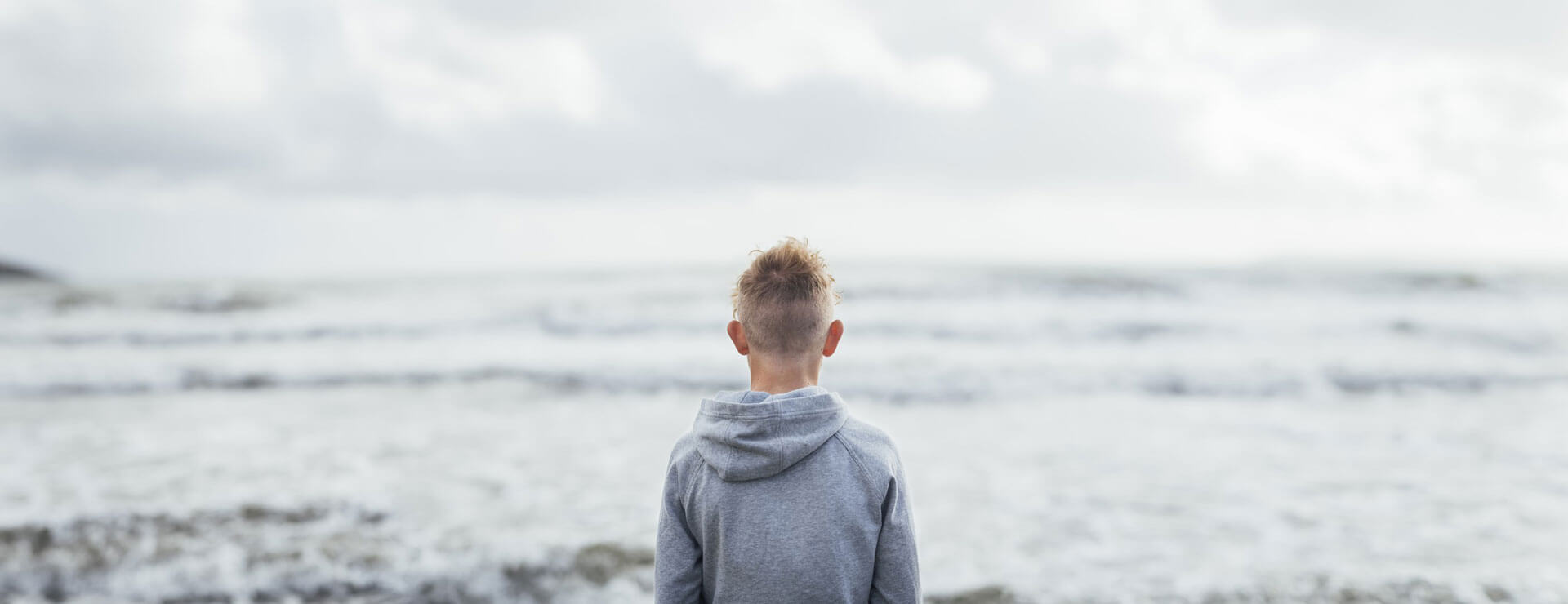 teen looks out on the water