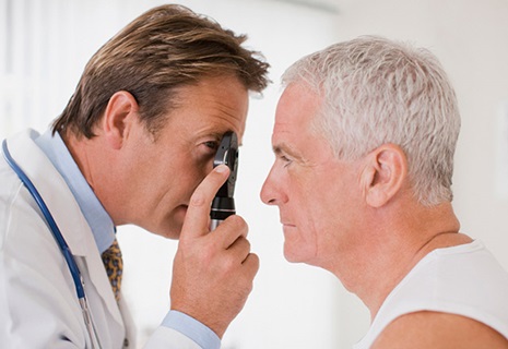 Eye doctor examines a patient's vision