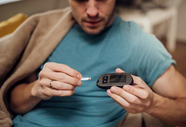 Man checking his blood sugar
