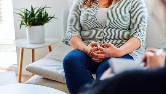 Overweight woman talking with a medical professional