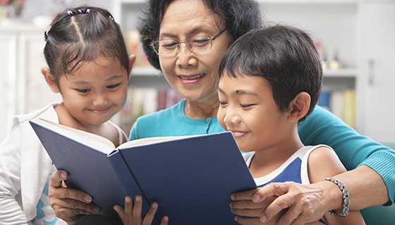 grandmother reading to children