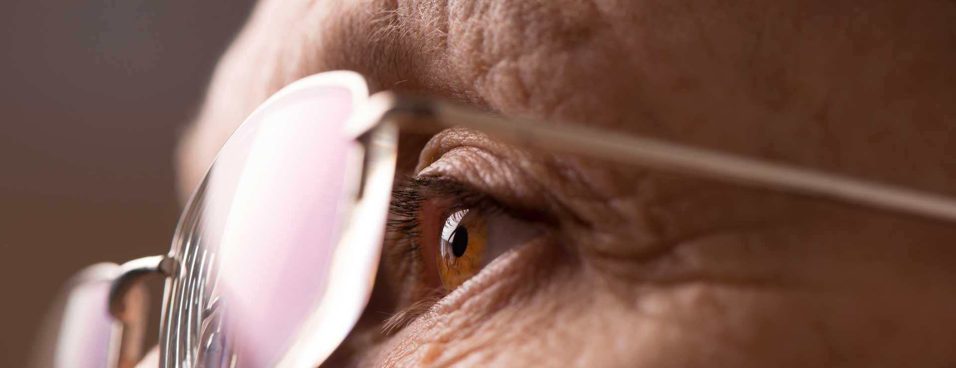elderly woman eye with glasses