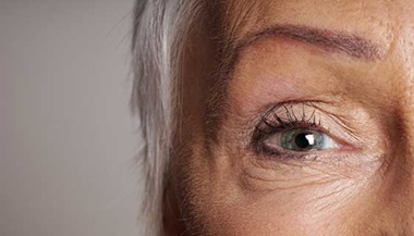 closeup of senior woman green eye