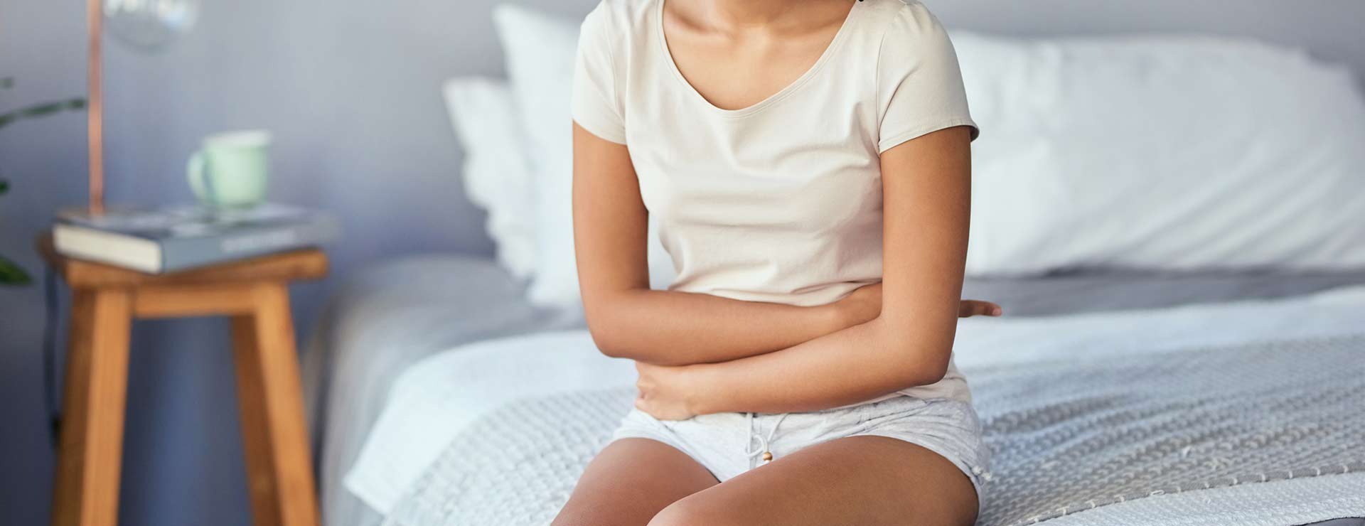 Woman clutching her stomach in pain