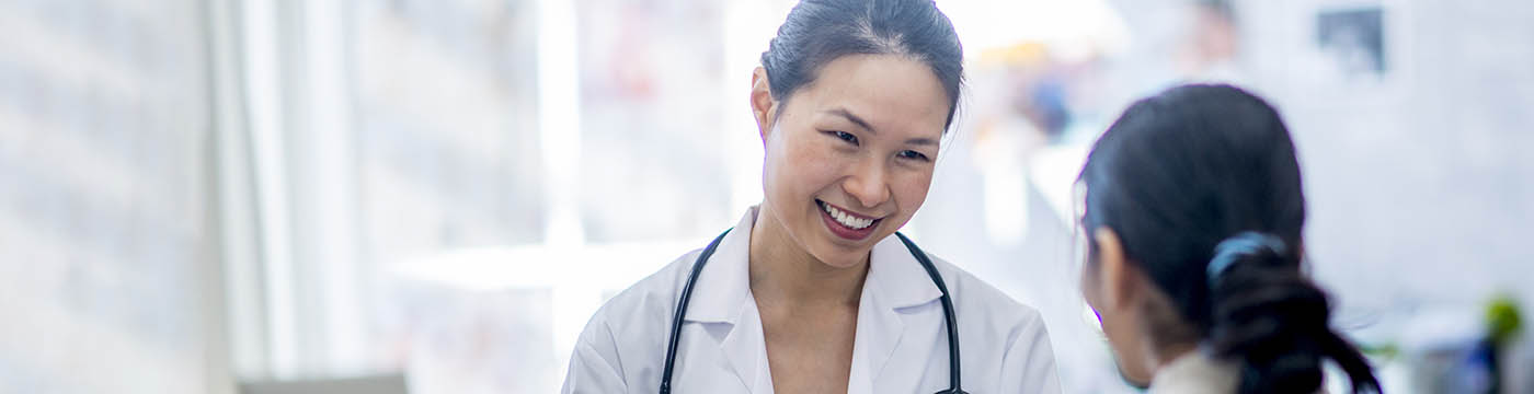 woman talking to doctor