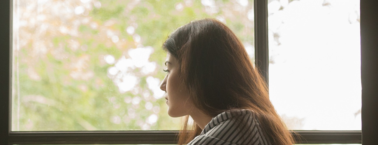anxiety and heart disease - woman looking out of window