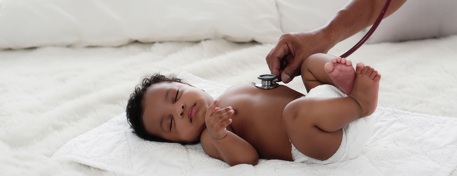 Atrial Septal Defect and Ventricular Septal Defect in Children - doctor listening to baby's chest